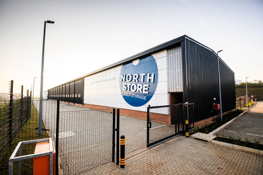 Low shot of the North Store signage in the early morning, sun rising over the self storage facility