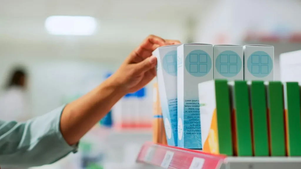 Consumer selecting medical items off a Ballito pharmancy shelf